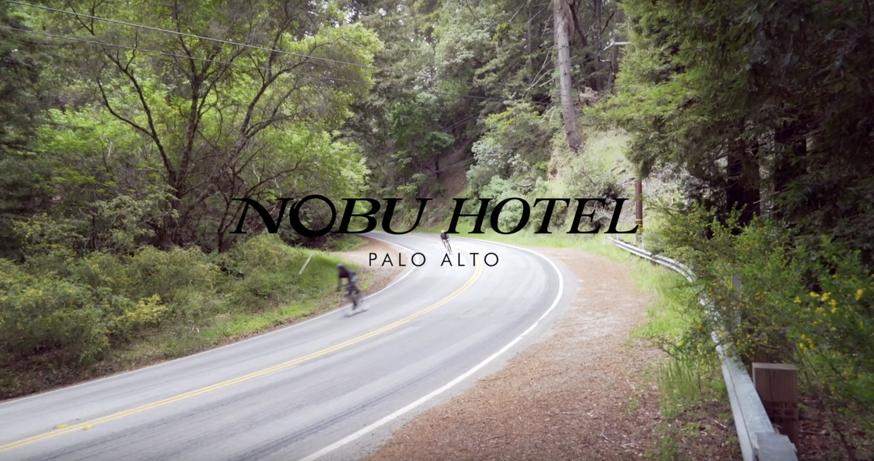 Nobu Hotel Palo Alto logo over cyclist on road